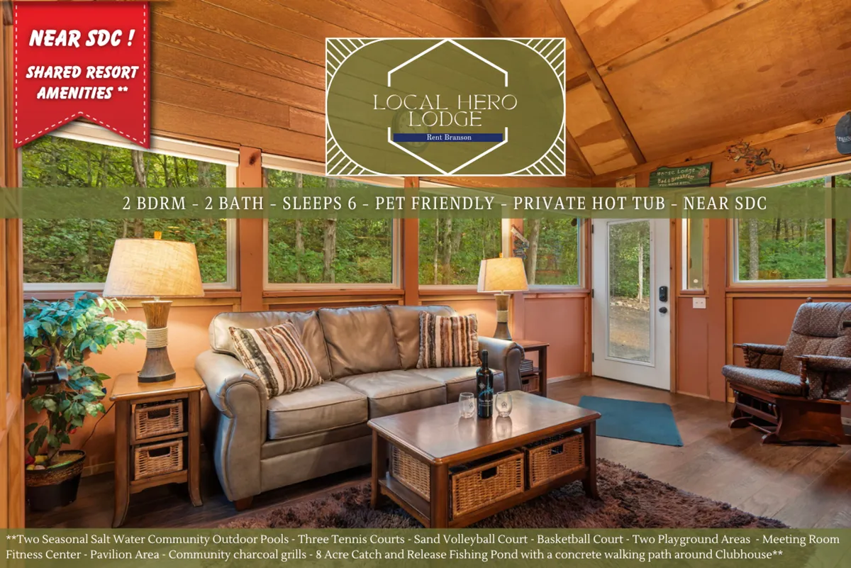 A comfortable living area with a plush sofa, wooden coffee table, and large panoramic windows that flood the room with natural light. Decorative plants add to the inviting vibe, and the view outside encourages relaxation or wildlife viewing.